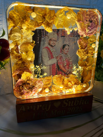 Resinn 6 inch block with Couple photo & Name date with LED stand Varmala Preservation Resinn 6 inch block with Couple photo & Name date with LED stand Varmala Preservation