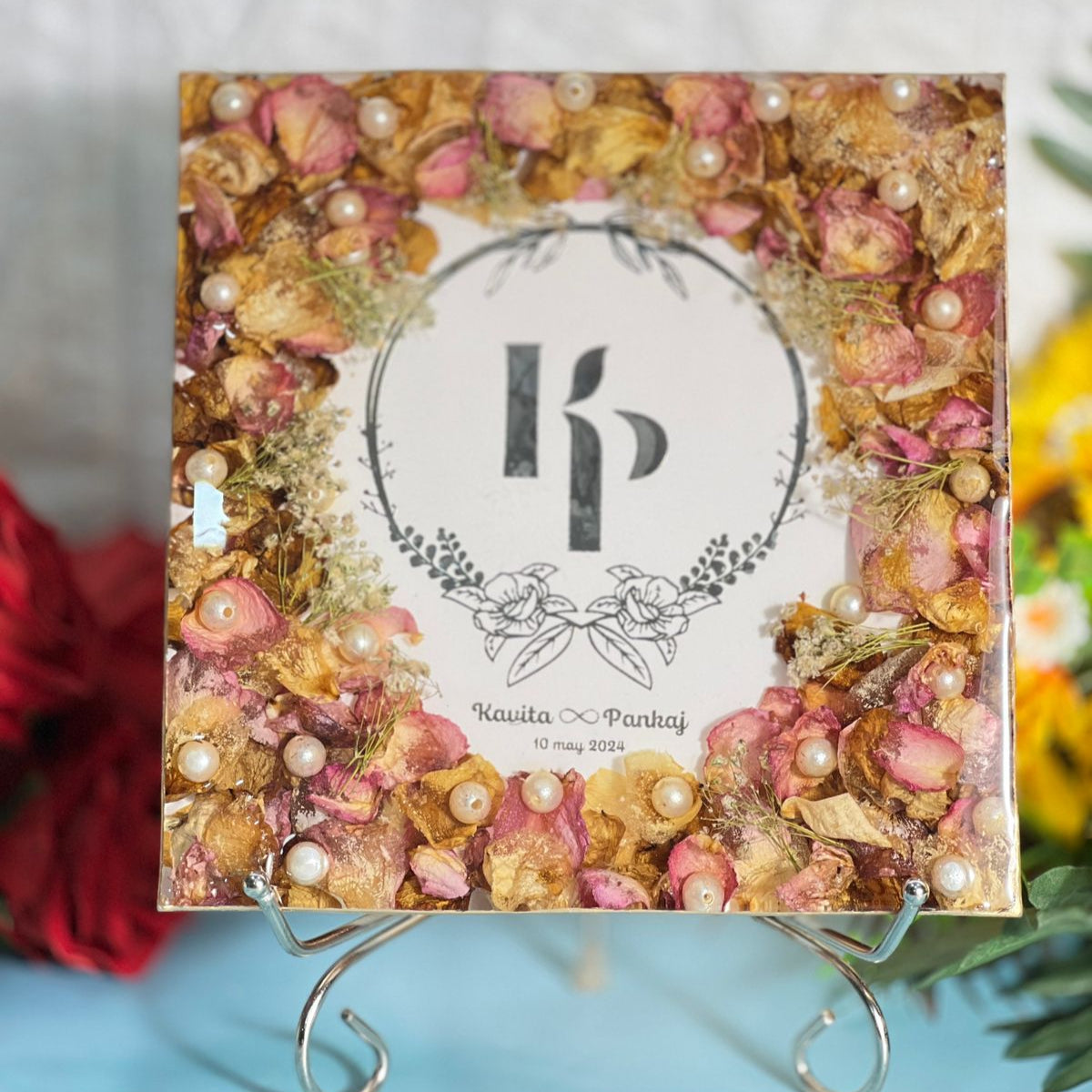 Square resin block with pink and peach varmala petals around a couple initials monogram, names and date