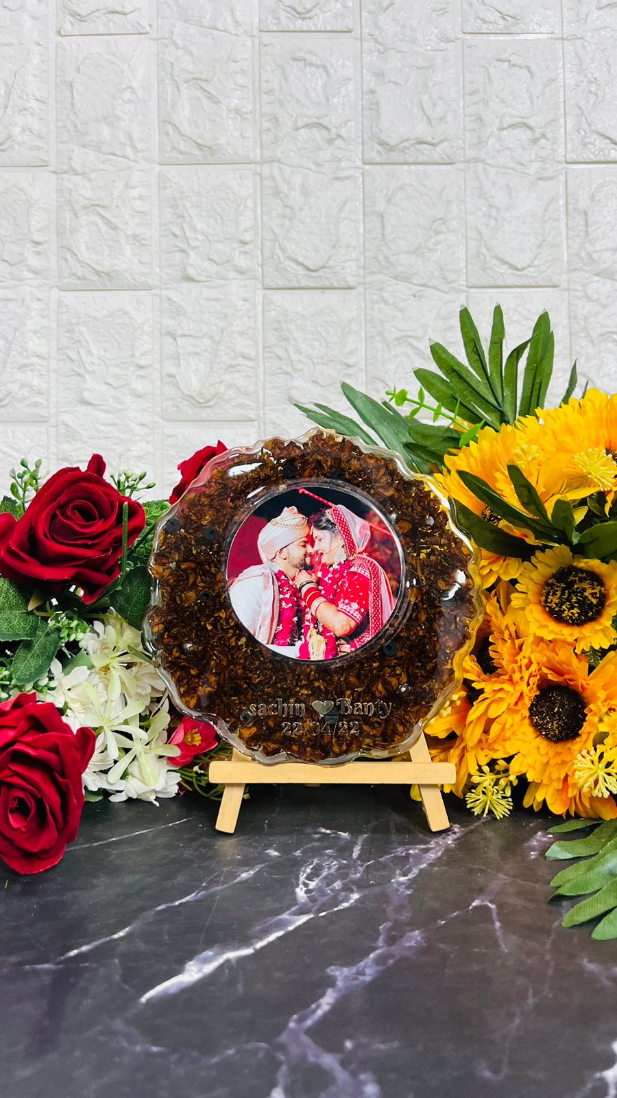 6 inch round resin block with red petals and couple photo on wooden stand