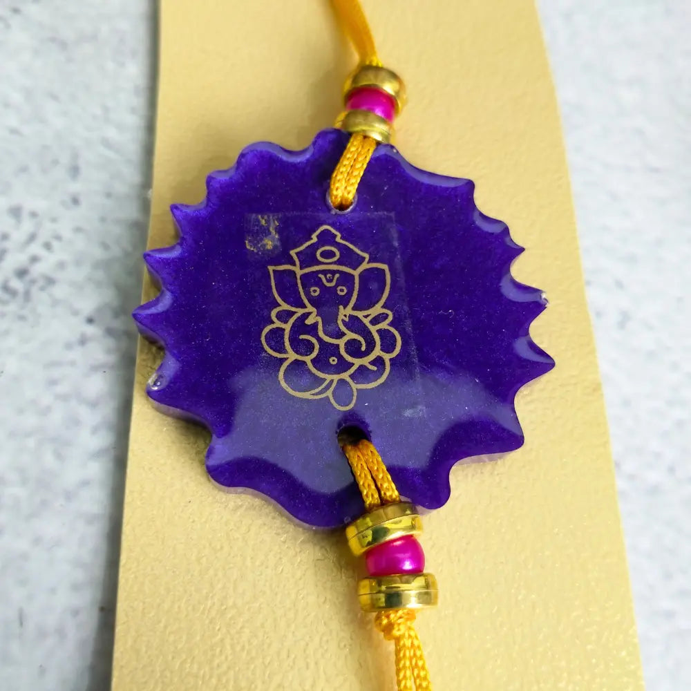 Purchase Purple Resin Rakhi With Ganesh Ji For Chota Bhai