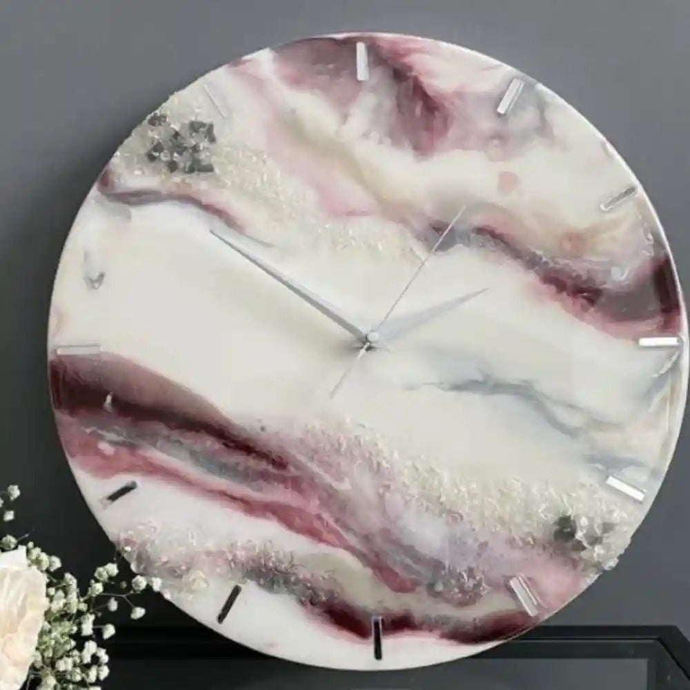 Close view of the pink, white and grey abstract epoxy resin wall clock