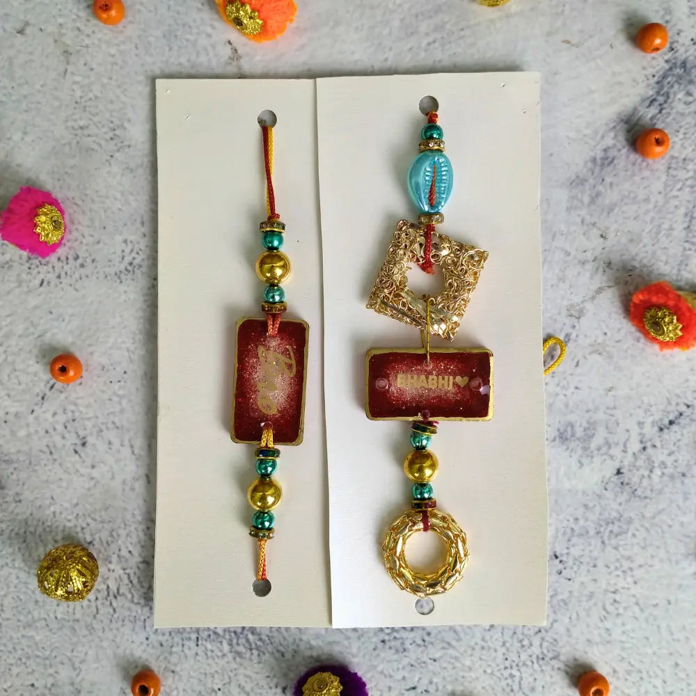 Red Resin Couple Rakhi For Bhaiya Bhabhi