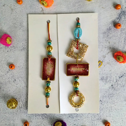Red Resin Couple Rakhi For Bhaiya Bhabhi