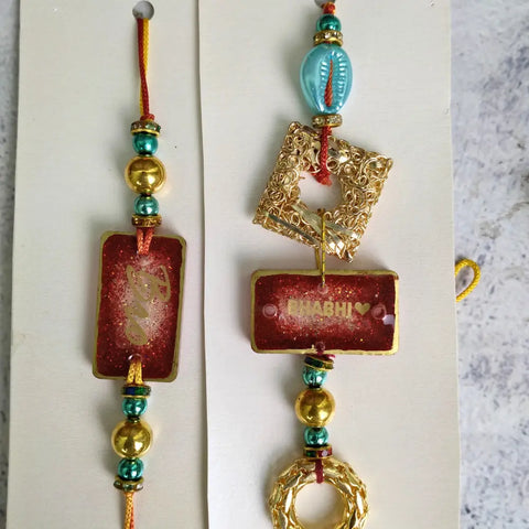 Red Resin Couple Rakhi For Bhaiya Bhabhi