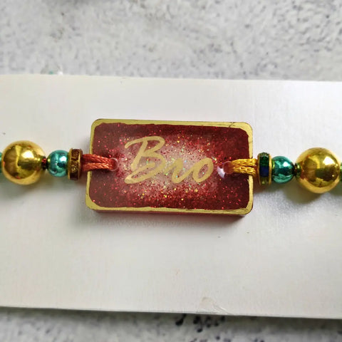 Red Resin Couple Rakhi For Bhaiya Bhabhi