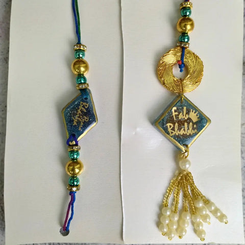 Purple & Gold Resin Couple Rakhi For Pyara Bhaiya Bhabhi (Set Of Two)