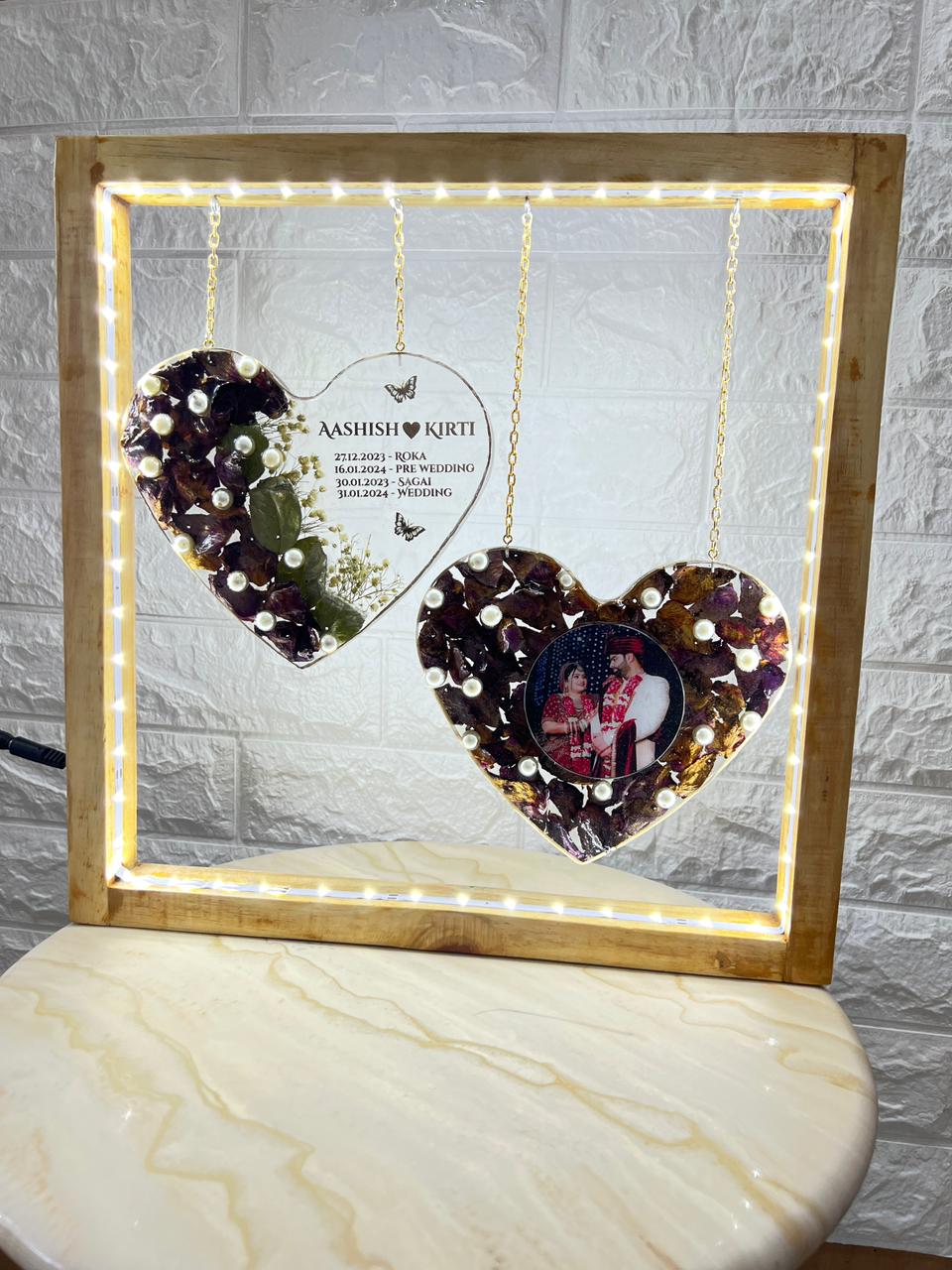 Dual heart resin varmala frame with maroon roses and names