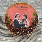8 inch round varmala preservation table frame with pink base, dark roses below