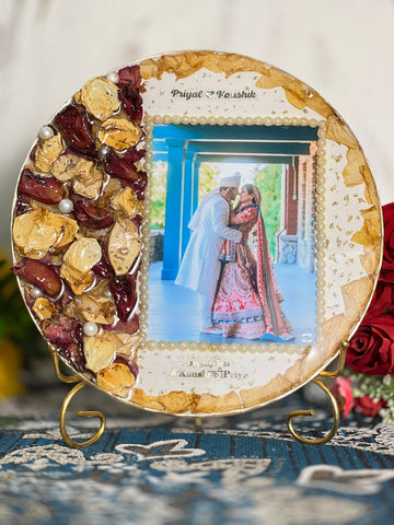 Resin 10inch round with red and yellow patels with moti and couple photo and name and date with metal stand Varmala Preservation