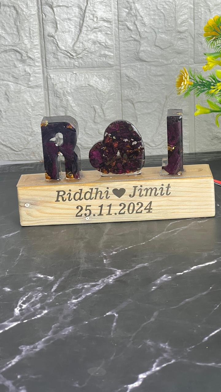 Resin Name initial Lamp with LED stand and Couple Name and Date with Red Roses Petals  Varmala Preservation