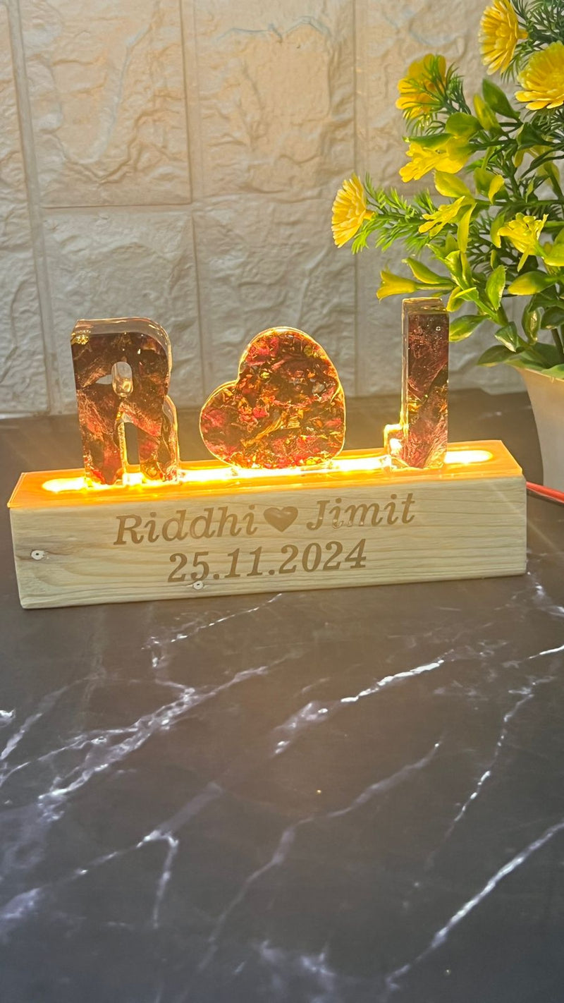 Resin Name initial Lamp with LED stand and Couple Name and Date with Red Roses Petals  Varmala Preservation