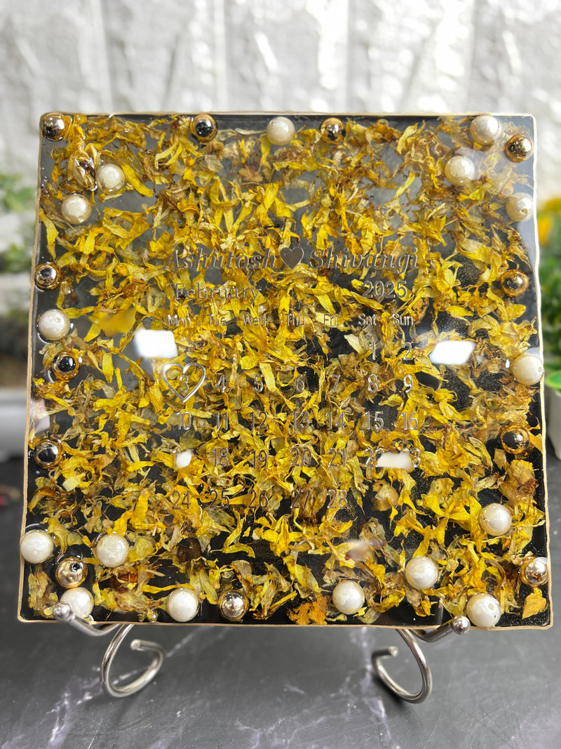 Resin 8 inch square frame with   black base petals and name date n calendar on the top with metal stand  Varmala Preservation