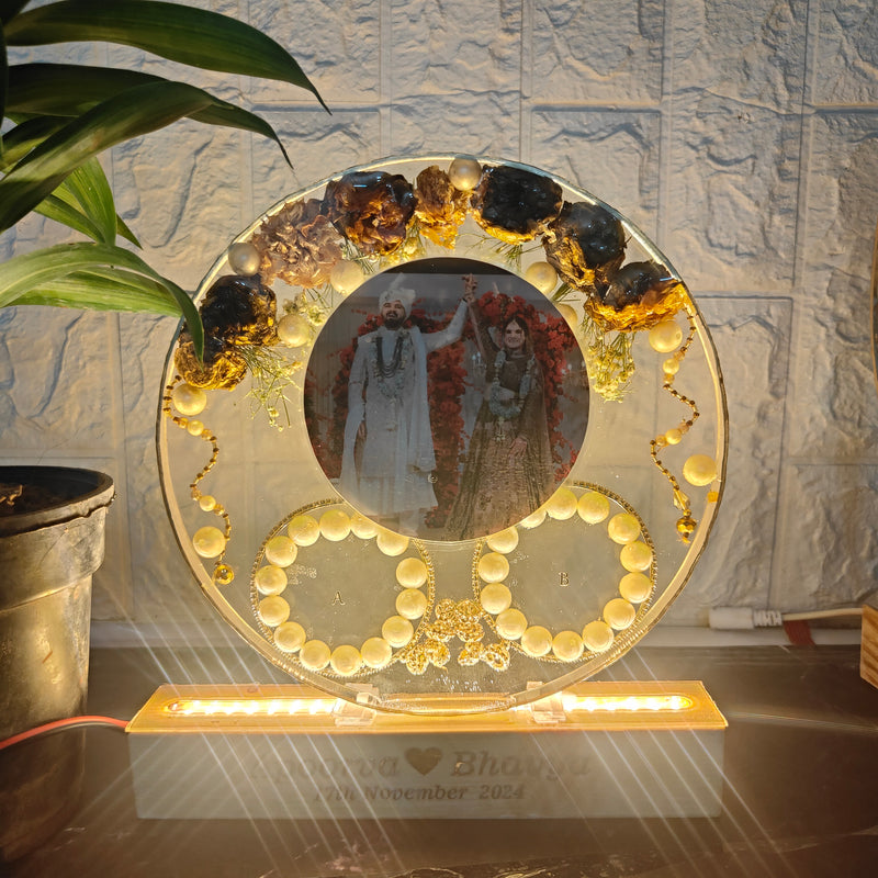 Resin 8inch round With LED stand Half side flowers and Couple photo and Name & Date with Pearls border and Keleera preserved in Varmala Preservation