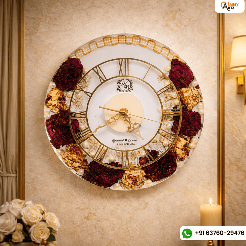 Resin 12 inch clock with In 3/4 part covered with flowers , upr part with pearl 2 lines white base in middle pink colour with logo in center Varmala Preservation