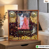 Square resin frame with varmala petals, kalangi, kaleera and couple photo