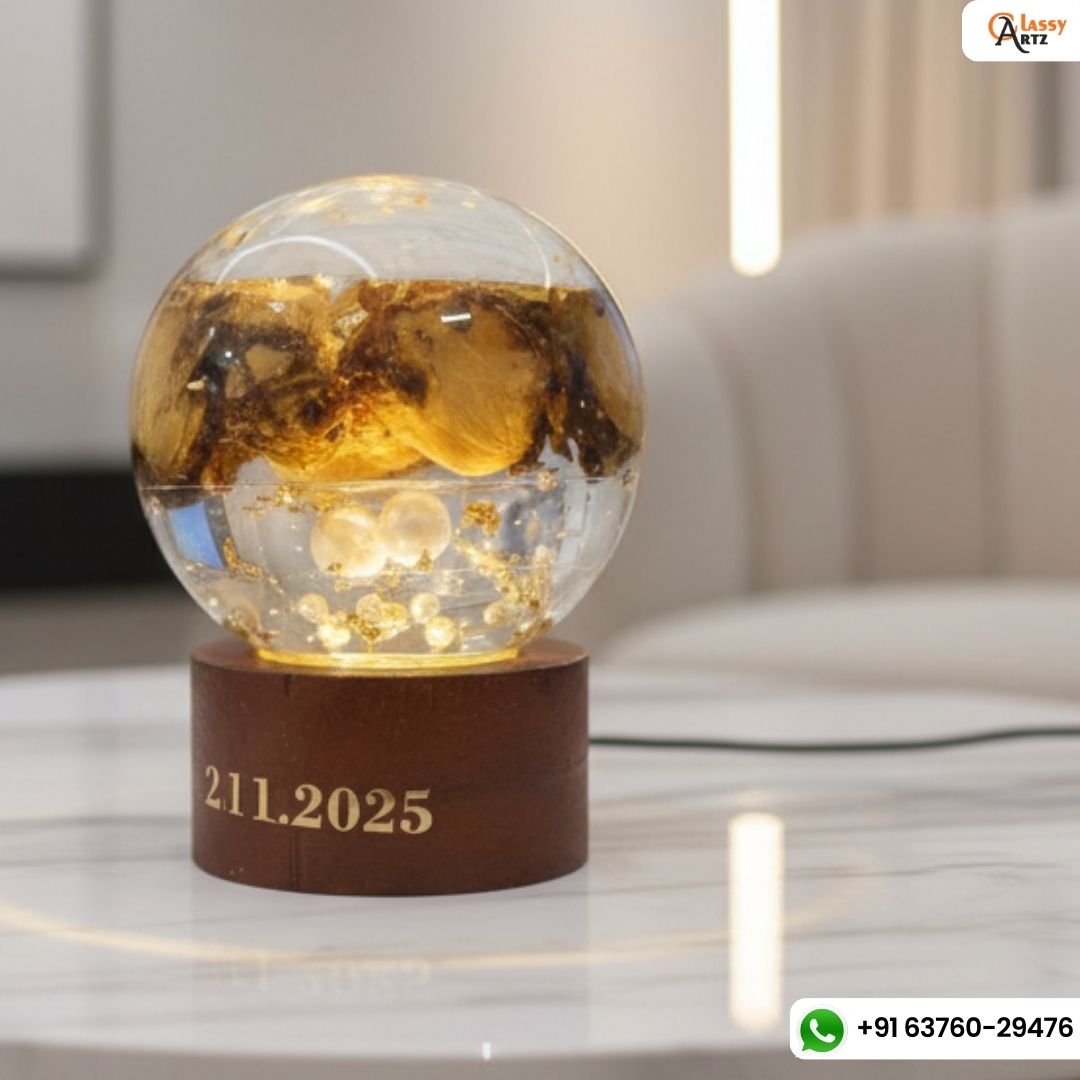 Resin globe lamp with golden roses on a stand