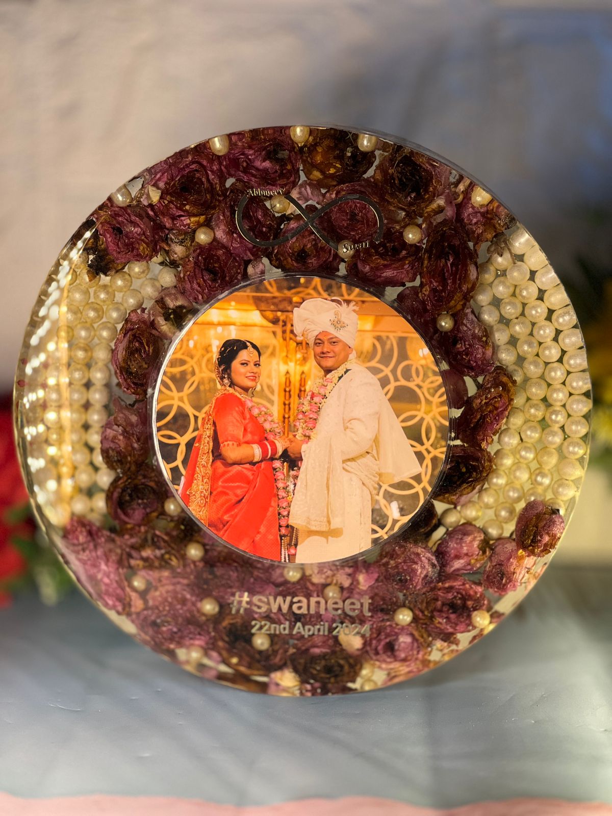 Pinck Rose Flower Preserved in Round Resin Varmala Frame | Half Floral – Half Pearl Deepcasted Epoxy Jai Mala Frame | Epoxy Garland Resin Frame Preserve With Couple Name  , Infinity Sign And LED stand