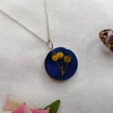 blue resin pendant with preserved baby breath flower