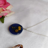 buy blue resin pendant with preserved baby breath flower