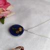 buy blue resin pendant with preserved baby breath flower