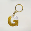Buy Trendy Golden sparkle Resin keychains with multi Alphabet Perfect Gift for Women