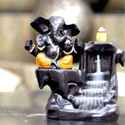 Ganesha Orange Backflow Waterfall Statue dhoop batti Holder Decorative Showpiece with 10 Free Smoke Backflow Scented Cone Incenses For Table, Car Dashboard , Office, Home Decor