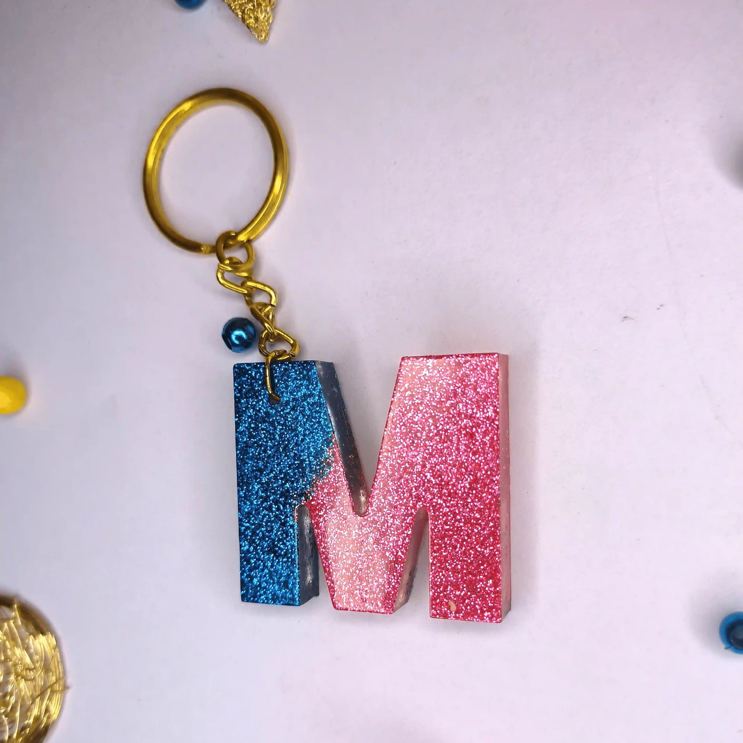 Get Multi-color shine resin keychains with m Letter For Best Friend