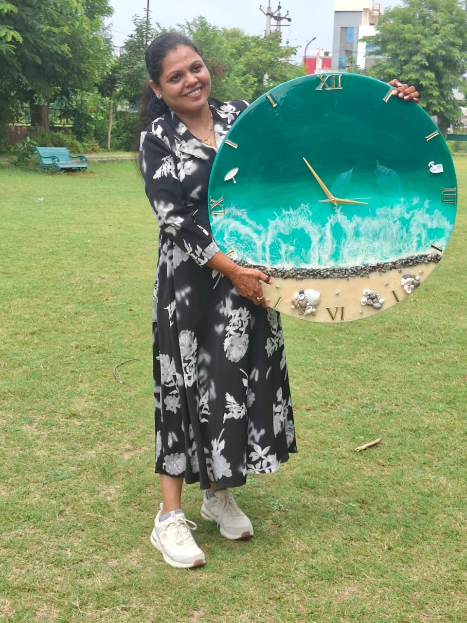 Inspection in our studio: a green ocean resin wall clock with a white wave edge
