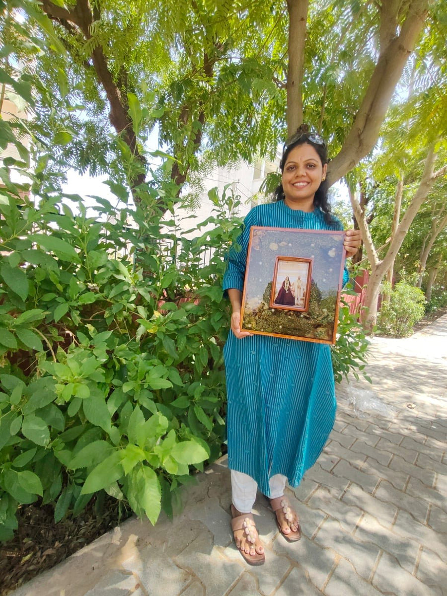 Small varmala photo frame shown in a garden, made in our Jaipur studio
