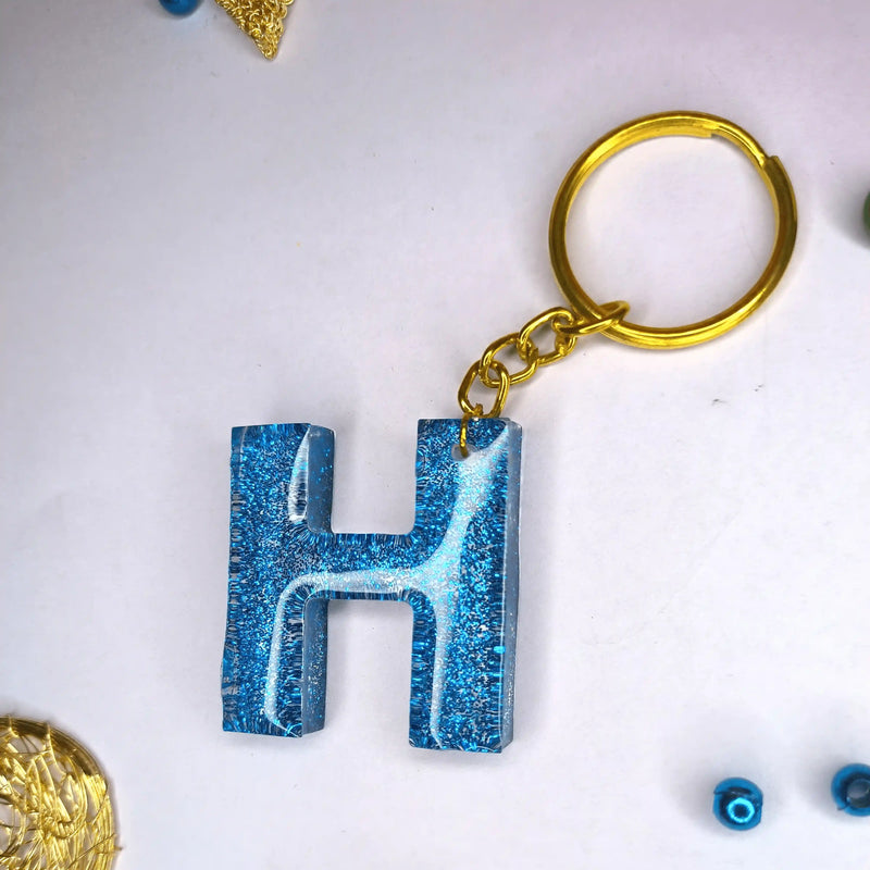 Purchase Customized blue Glitter Resin keychains with H initials For Friendship day