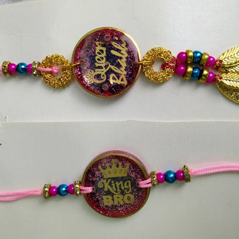 Purchase Resin Glitter Couple Rakhi For Bhaiya Bhabhi